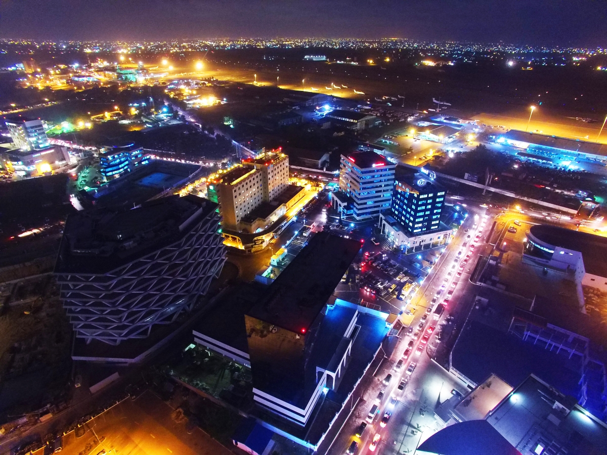 Aerial night view of Airport City and Kotoka International Airport in Accra